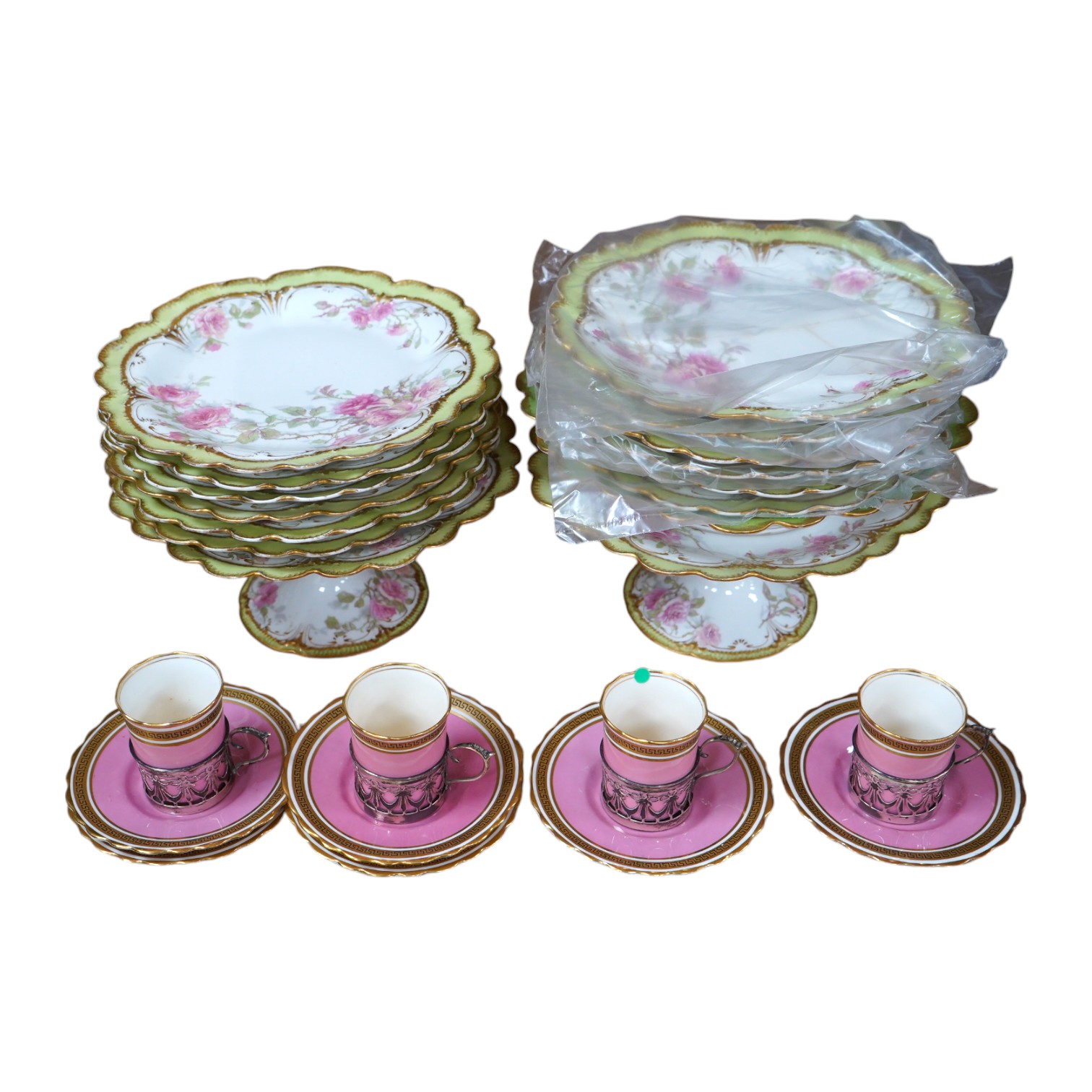 A French porcelain part dessert service together with a set of four Aynsley cups and saucers, the cups with silver holders. Condition - varies, some repairs